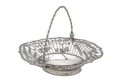Lot 360 - A George III sterling silver bread basket, London 1767 by William Plummer (reg. 8th April 1755)