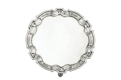 Lot 293 - A George II sterling silver tea or coffee pot stand, London 1732 by John Swift (reg. between May-Oct 1728)