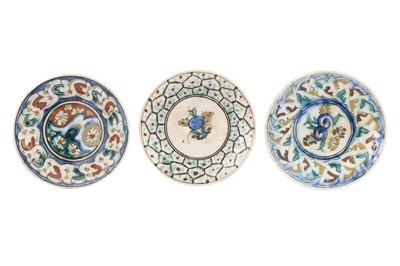 Lot 244 - THREE KUBACHI POTTERY SAUCERS