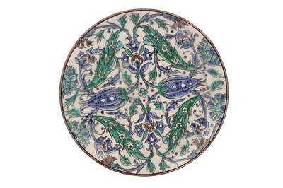 Lot 185 - A REVIVAL IZNIK-STYLE POTTERY PLATE