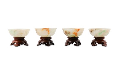 Lot 531 - FOUR CHINESE APPLE-GREEN JADEITE BOWLS.