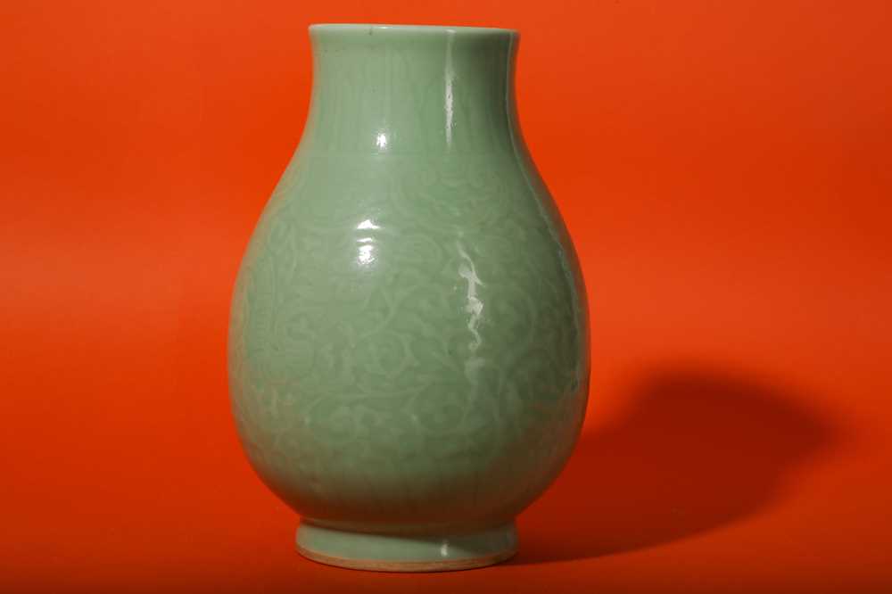 Lot 3 - A CHINESE CELADON-GLAZED 'DRAGON' VASE.