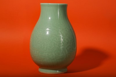 Lot 3 - A CHINESE CELADON-GLAZED 'DRAGON' VASE.