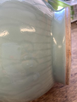 Lot 3 - A CHINESE CELADON-GLAZED 'DRAGON' VASE.