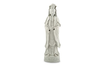 Lot 40 - A CHINESE BLANC-DE-CHINE FIGURE OF GUANYIN.