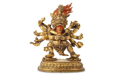 Lot 55 - A TIBETAN GILT-BRONZE FIGURE OF YAMANTAKA.