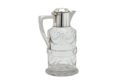 Lot 346 - A George V sterling silver mounted glass claret jug, London 1914 by Goldsmiths and Silversmiths