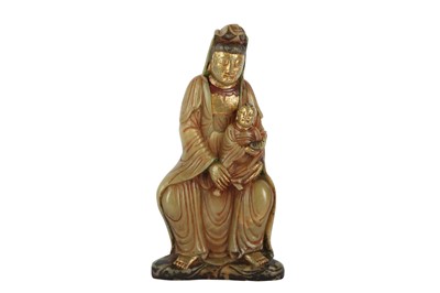 Lot 227 - A CHINESE SOAPSTONE FIGURE OF GUANYIN AND CHILD.