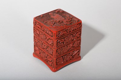 Lot 37 - A CHINESE CINNABAR LACQUER THREE-TIERED BOX AND COVER.
