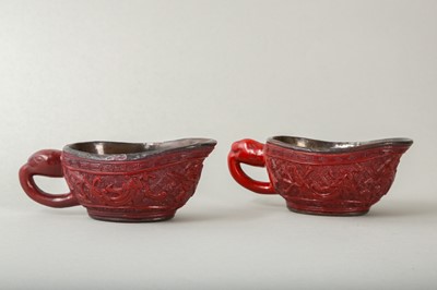 Lot 38 - A PAIR OF CHINESE CINNABAR LACQUER POURING VESSELS, YI