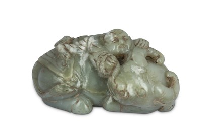 Lot 667 - A CHINESE PALE CELADON JADE 'BOY AND BUFFALO CARVING.