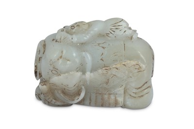 Lot 668 - A CHINESE PALE CELADON JADE CARVING OF A BOY AND AN ELEPHANT.