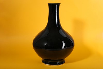 Lot 4 - A CHINESE MIRROR BLACK-GLAZED BOTTLE VASE.