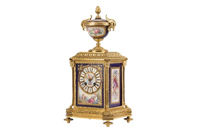 Lot 22 - A THIRD QUARTER 19TH CENTURY FRENCH NAPOLEON III GILT BRONZE AND SERVES PORCELAIN MANTEL CLOCK