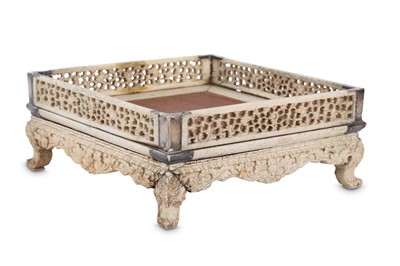 Lot 491 - A CHINESE SQUARE-SECTION RETICULATED BONE STAND.