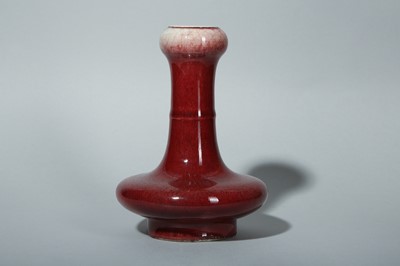 Lot 118 - A CHINESE COPPER RED-GLAZED GARLIC NECKED VASE.