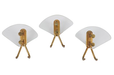 Lot 139 - MANNER OF FONTANA ARTE, ITALY: Three brass and glass coat hooks