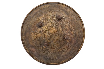 Lot 401 - A QAJAR GILT-COPPER SHIELD