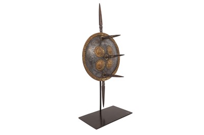 Lot 406 - A BRASS-OVERLAID STEEL HAND SHIELD WITH SPIKES