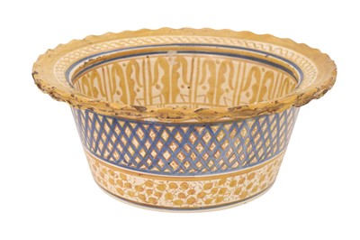Lot 179 - AN HISPANO-MORESQUE COPPER-LUSTRE POTTERY BASIN
