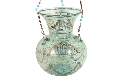 Lot 837 - A MAMLUK-REVIVAL ENAMELLED CLEAR GREEN GLASS MOSQUE LAMP
