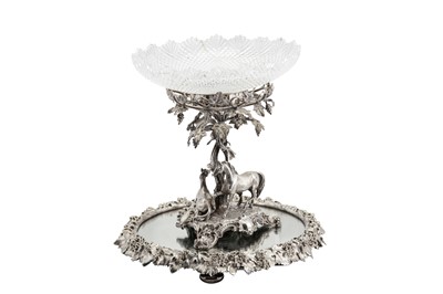 Lot 257 - A Victorian silver plated (EPNS) figural centrepiece on a mirror plateau, circa 1860, the centrepiece by Barnards