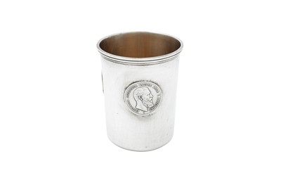 Lot 116 - A late 19th century German unmarked silver coin set beaker, circa 1889