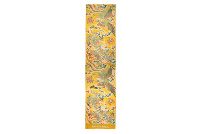 Lot 365 - A LARGE CHINESE YELLOW-GROUND 'DRAGON AND PHOENIX' TEXTILE.