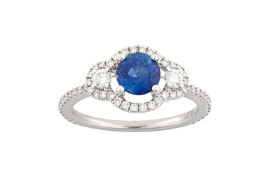 Lot 1256 - A sapphire and diamond ring