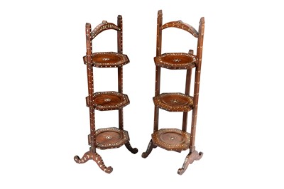 Lot 211 - λ A NEAR PAIR OF HARDWOOD IVORY-INLAID ANGLO-INDIAN TIERED TEA TRAYS