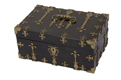 Lot 130 - A LATE VICTORIAN ENGLISH GOTHIC REVIVAL BRASS MOUNTED EBONY STATIONARY BOX