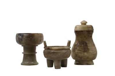 Lot 467 - THREE CHINESE PALE CELADON JADE ARCHAISTIC VESSELS.