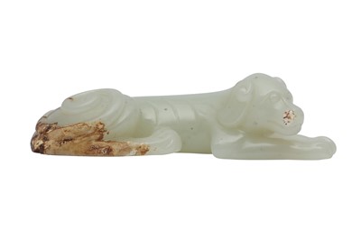 Lot 478 - A CHINESE PALE CELADON JADE CARVING OF A DOG.