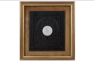 Lot 82 - A 19TH CENTURY CARVED EBONY & IVORY PLAQUE