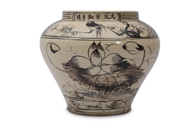 Lot 581 - A CHINESE GLAZED SLIP-DECORATED JAR.
