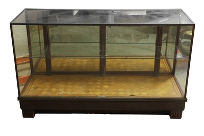 Lot 155 - AN EARLY 20TH CENTURY BRASS MOUNTED GLAZED TEAK SHOP / HABERDASHERY CABINET