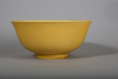 Lot 145 - A CHINESE YELLOW-GLAZED BOWL.