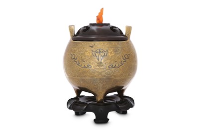 Lot 228 - A CHINESE GOLD AND SILVER-INLAID 'TAOTIE MASK' INCENSE BURNER.