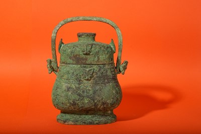 Lot 110 - A CHINESE BRONZE RITUAL VESSEL AND COVER, YOU.