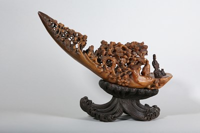 Lot 65 - λ A LARGE AND IMPRESSIVE CHINESE RHINOCEROS HORN 'IMMORTALS' RAFT' CARVING.