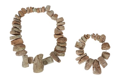 Lot 64 - AN ANCIENT CHINESE PERIOD COLLECTION OF CARVED STONE BEADS