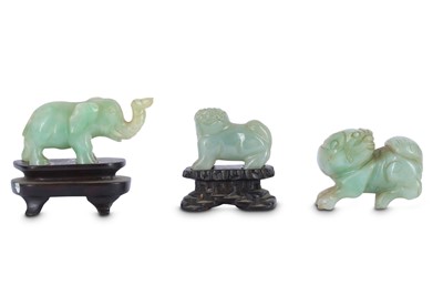 Lot 333 - THREE CHINESE JADE AND JADEITE CARVINGS.