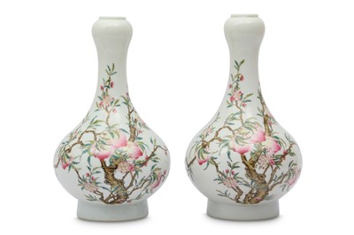 Lot 569 - A PAIR OF CHINESE FAMILLE ROSE GARLIC MOUTH 'PEACHES' VASES.