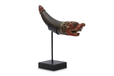 Lot 753 - A TIBETAN WOOD 'MAKARA' POWDER FLASK.