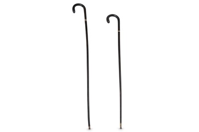 Lot 358 - λ TWO RHINOCEROS HORN WALKING STICKS.
