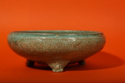 Lot 136 - A CHINESE CELADON-GLAZED TRIPOD INCENSE BURNER.