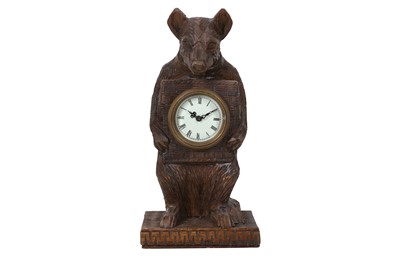 Lot 124 - A BLACK FOREST STYLE CARVED WOODEN MANTLE CLOCK