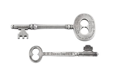 Lot 349 - TWO CASED EARLY 20TH CENTURY INDIAN COLONIAL UNMARKED SILVER PRESENTATION KEYS