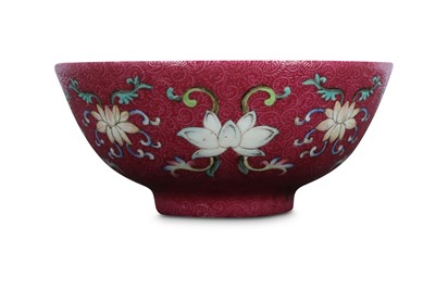 Lot 645 - A CHINESE FAMILLE ROSE RUBY-GROUND 'LOTUS' BOWL.
