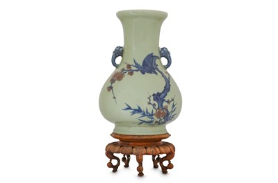 Lot 524 - AN UNDERGLAZE-COPPER-RED BLUE AND WHITE CELADON VASE.